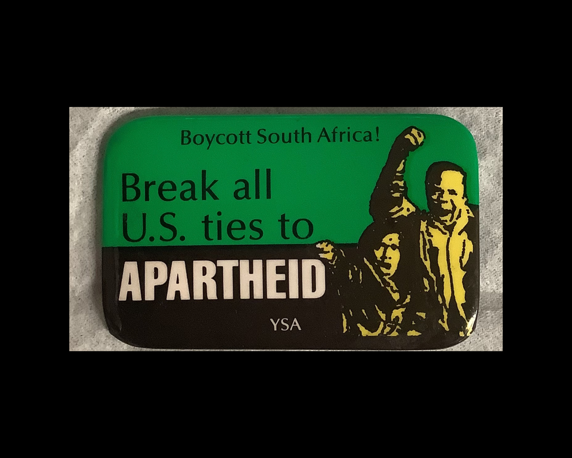 A button/pin distributed by YSA (Youth Service America), a global non-profit promoting youth service and civic responsibility. Boycotting South Africa was an anti-apartheid tactic used to pressure the South African government to end its system of racial segregation. 