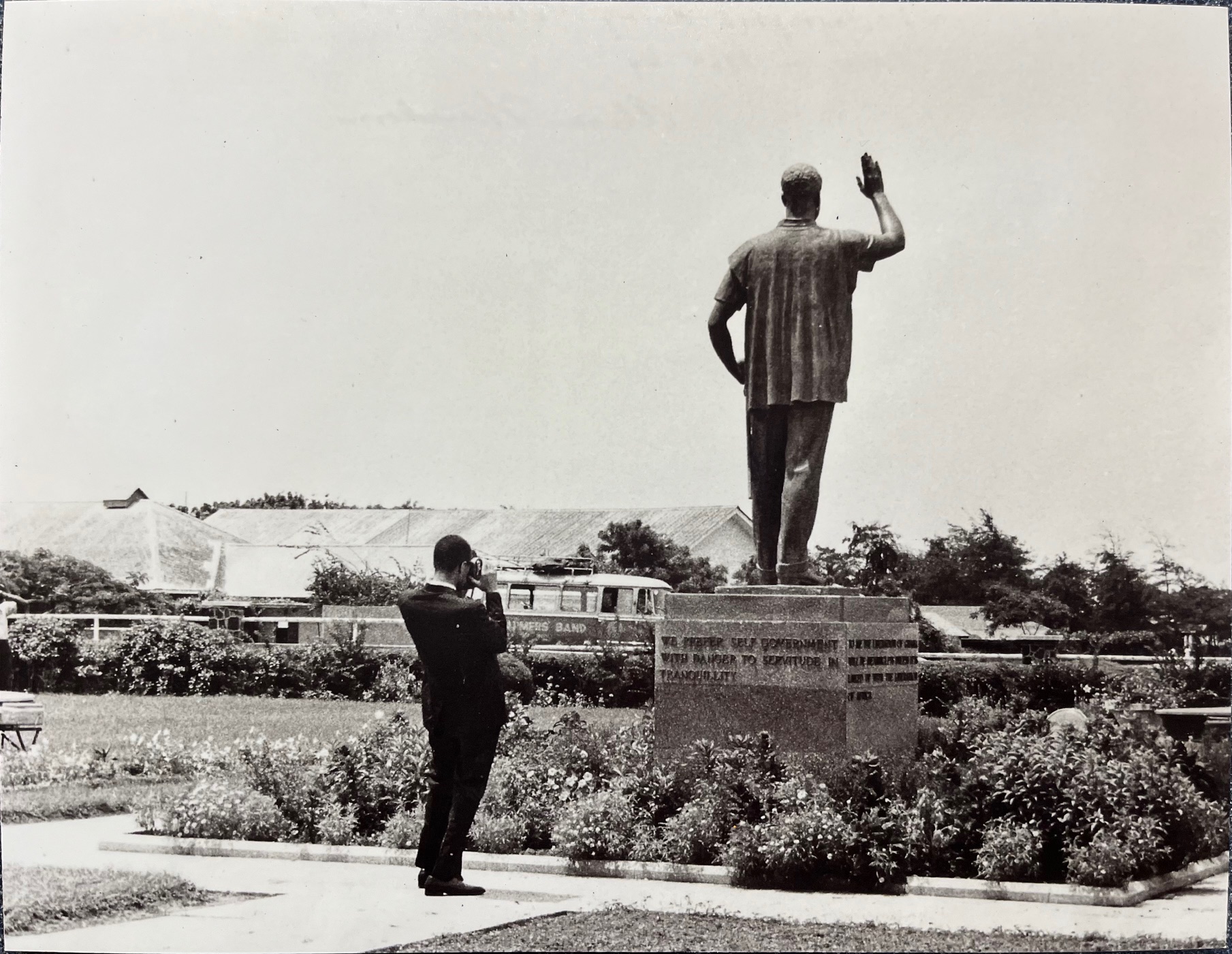 Malcolm X photographing statue of Nkrumah