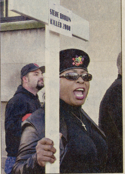 Sarah Bradley-Easter marches outside police headquarters, 2002
