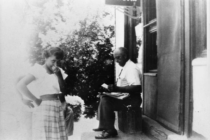 Charles Thomas and His Daughter, Alice, in front of the Thomas Grocery Store