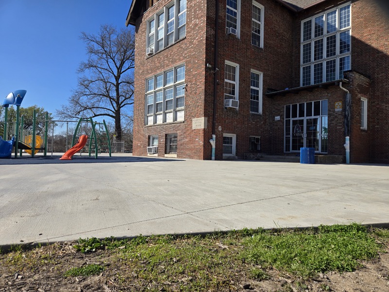 Exterior view of Gardenville School building and playground.