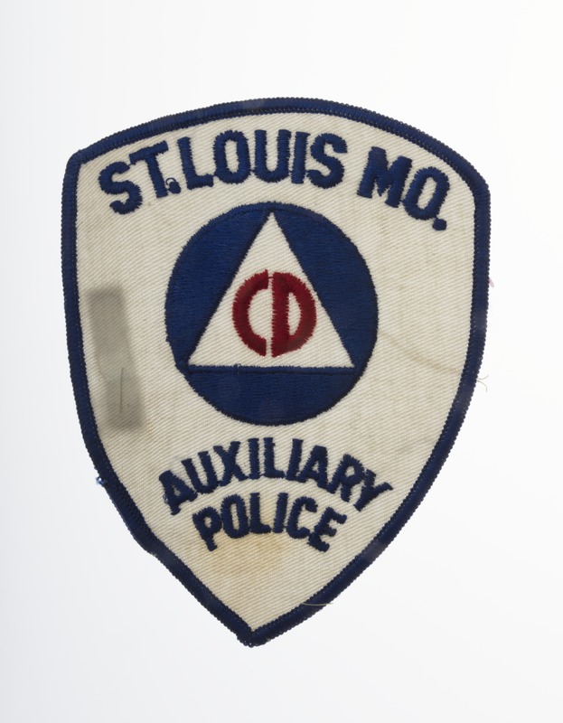 Shield shaped patch with Civil Defense logo and wording, "St. Louis, MO, Auxiliary Police."