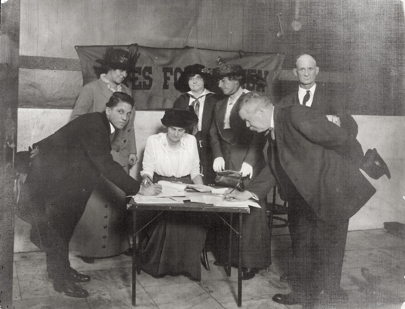 Photograph of Men Signing a Petition in Support of Women's Suffrage