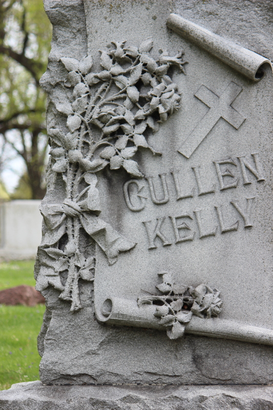 Cullen Kelly Cross, Floral, and Scroll Grave Marker