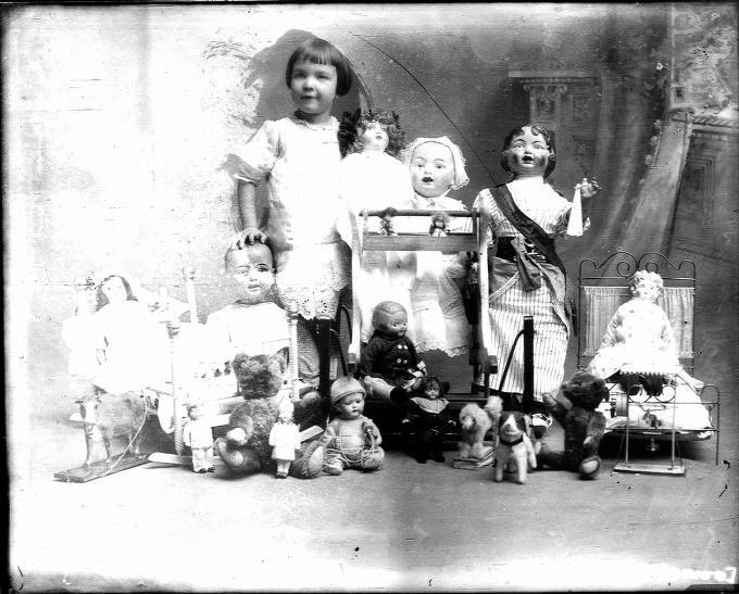 Glass Negative of Anna Lou Peterson with a Woman's Suffrage Doll