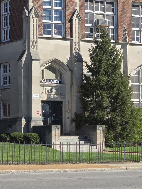 View of fallout shelter sign near an entryway to the Gallaudet School building.