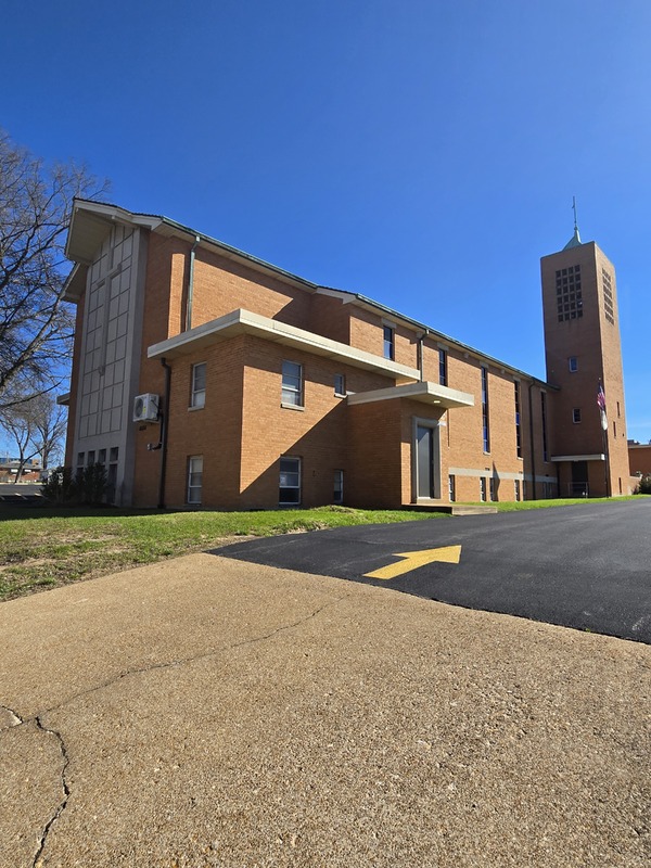 View of front and side of St. Lucas church building.