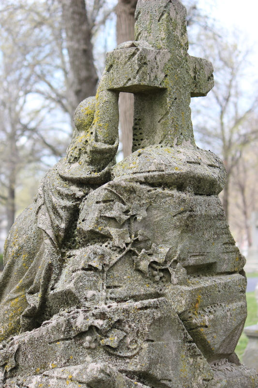 Mossy Gravestone with Cross and Human Figure