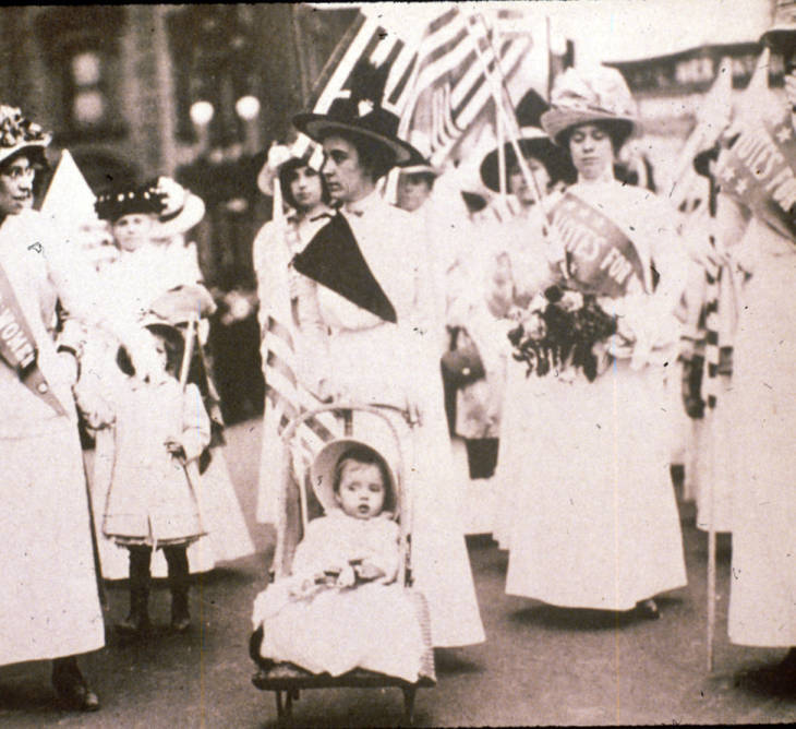 Photograph of a Woman with a Child at Suffrage Parade