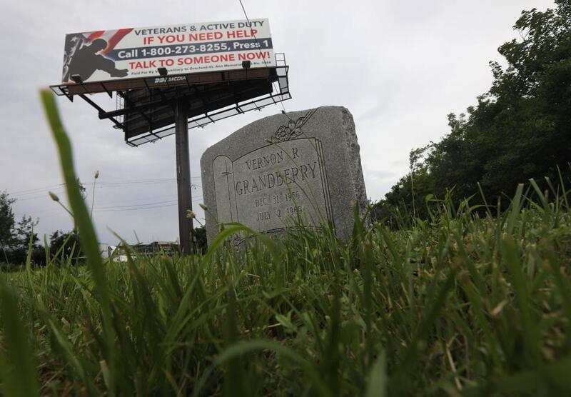 Billboard by Washington Park Cemetery
