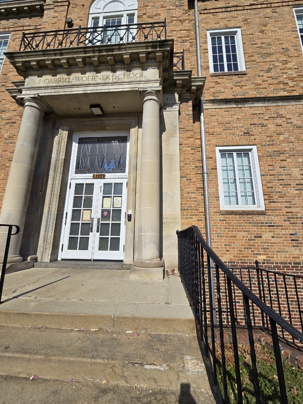 View of Woerner School building front entryway and cornerstone.