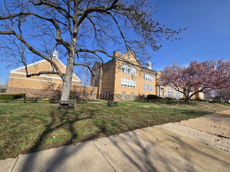 Wide view of the front and side of the Woerner School building.