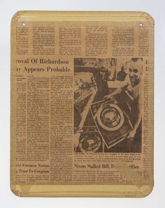 Section of news stories on the back of a map cut from a newspaper.