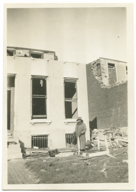 Woman in Front of Tornado Damaged Home