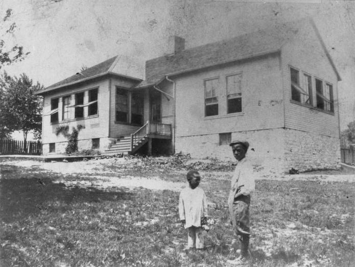 Two Unidentified Young Boys in Front of Douglass School