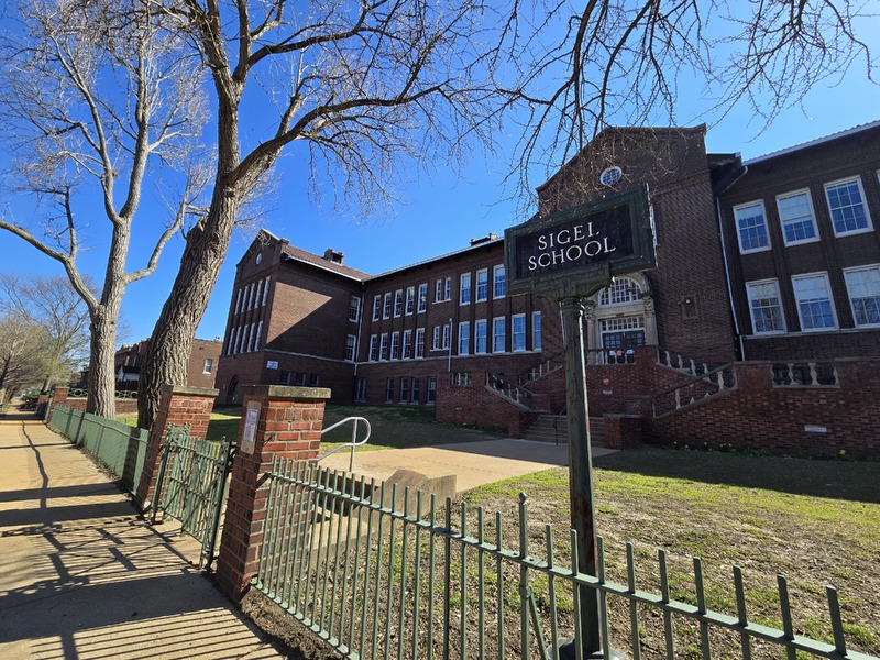 View of the front of the Sigel School building.