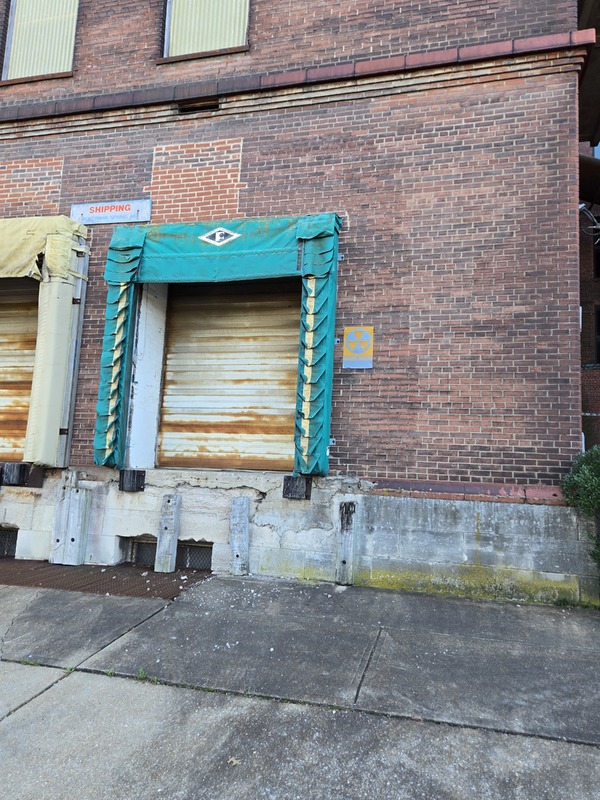 Warehouse Building with Fallout Shelter Sign