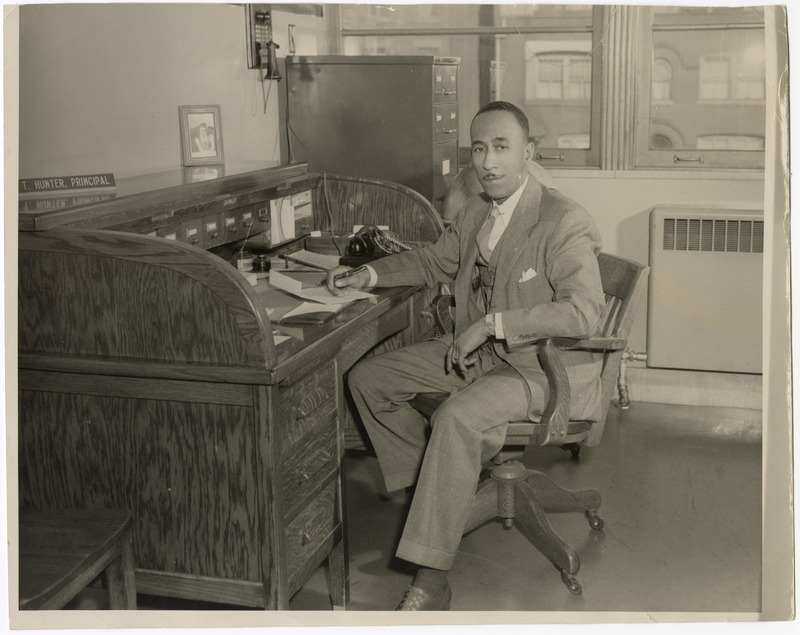 Principal Clarence T. Hunter Seated at His Desk
