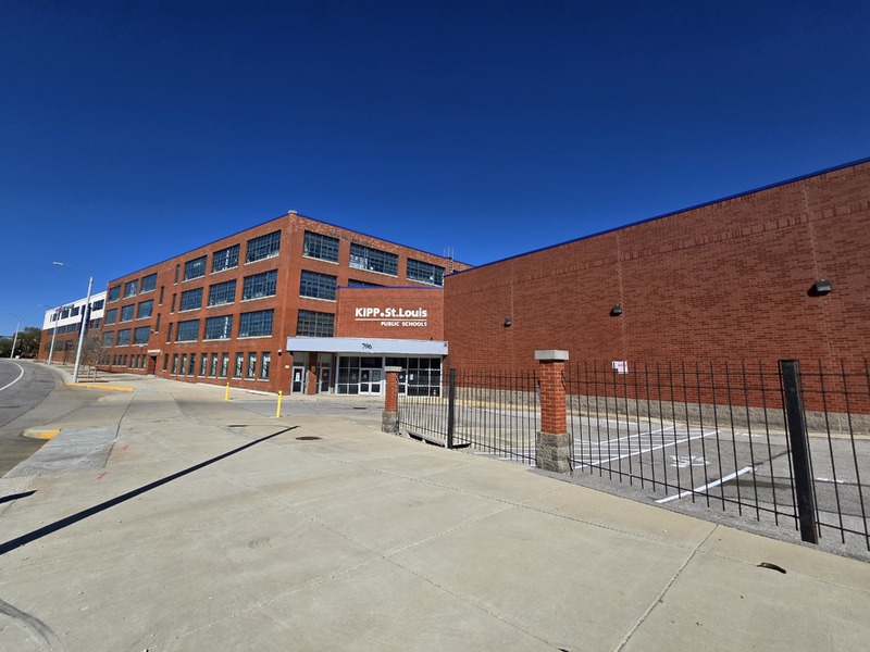 Wide view of front and side of KIPP School building.
