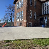 Exterior view of Gardenville School building and playground.
