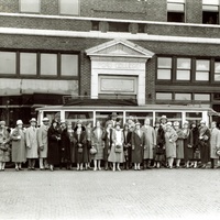 ANNIE MALONE (TENTH FROM RIGHT) WITH A GROUP OF FRIENDS CELEBRATING A WEDDING IN FRONT OF PORO COLLEGE.
