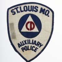 Shield shaped patch with Civil Defense logo and wording, "St. Louis, MO, Auxiliary Police."