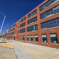 Wide view of side of KIPP School building.