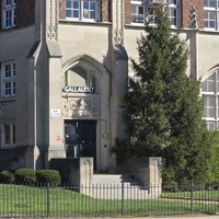 View of fallout shelter sign near an entryway to the Gallaudet School building.