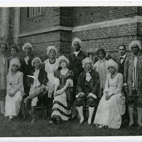 MASQUE AND WIG CLUB AT SUMNER HIGH SCHOOL. DR. HERMAN DREER SEATED WITH HANDS ON KNEES