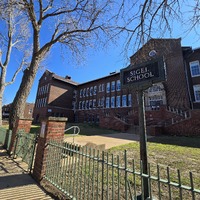 View of the front of the Sigel School building.