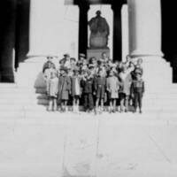 Children Standing at Monument during Field Trip
