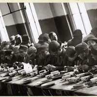 AFRICAN-AMERICAN MEN EATING AT A SOUP KITCHEN