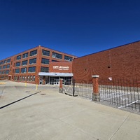 Wide view of front and side of KIPP School building.