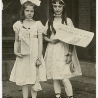 Photograph of Two Girls Holding a Newspaper Related to Women's Suffrage.jpg
